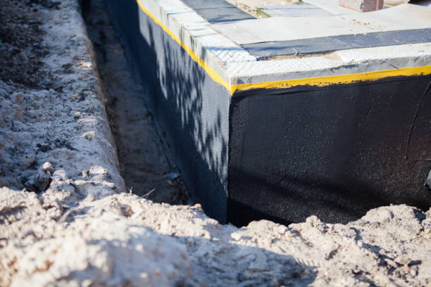 Professional Waterproofing technician working in Olivet, MI